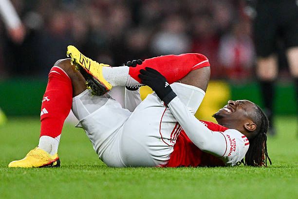 Eberechi Eze holding his legs in pain after suffering injury