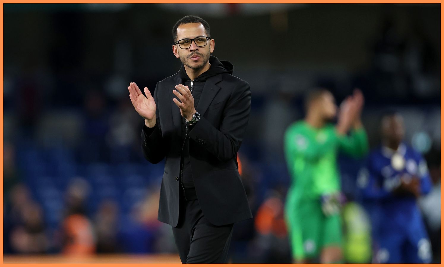 Liam Rosenior acknowledges Chelsea's fans after the defeat vs Manchester United