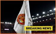 Manchester United logo on corner flag and breaking news banner