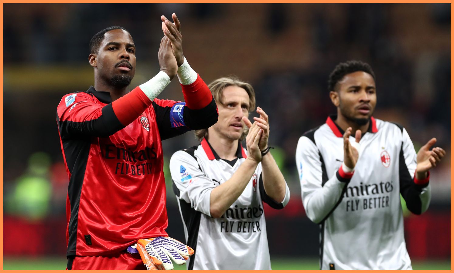 Mike Maignan applauds the AC Milan fans