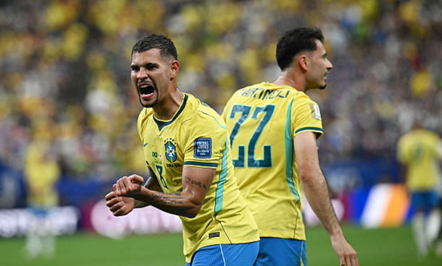 Gabriel Martinelli and Bruno Guimaraes celebrating the winner