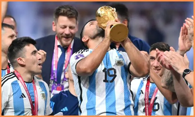 Argentina players celebrate with the World Cup trophy in 2022