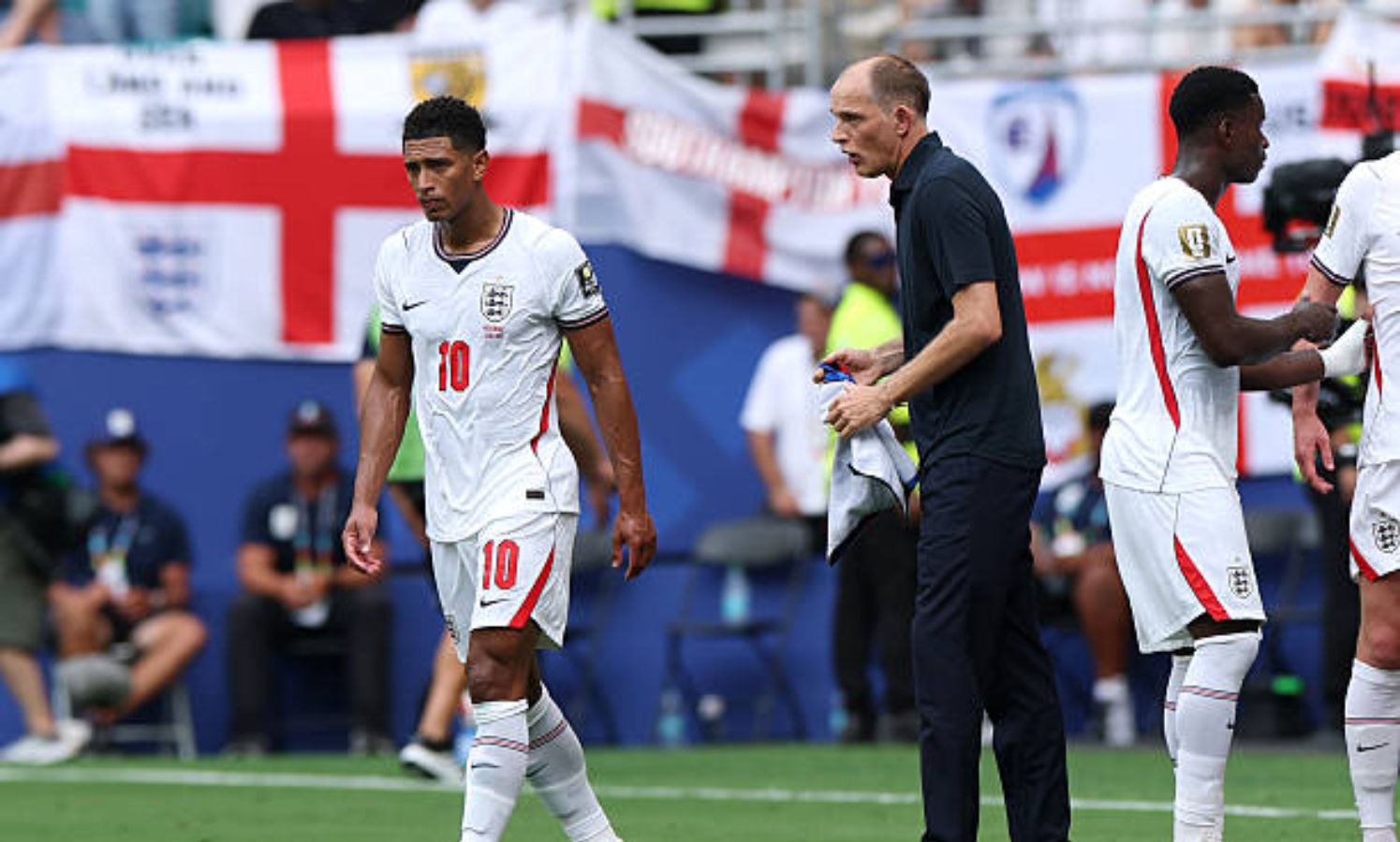 Jude Bellingham walking away from Thomas Tuchel
