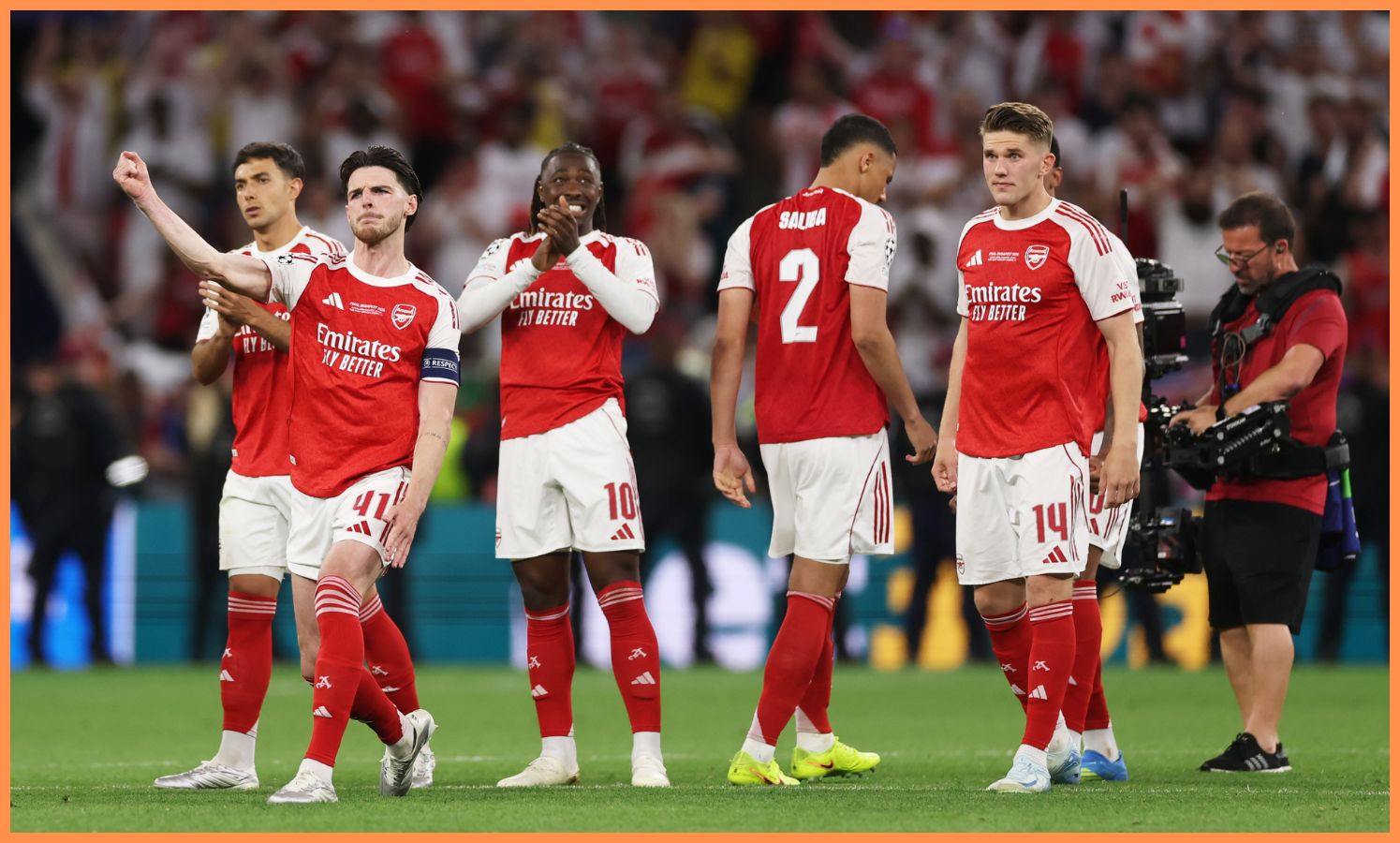 Arsenal players react during the Champions League final penalty shoot-out vs PSG