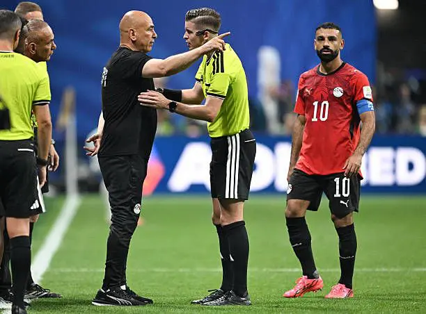 Egypt manager Hossam Hassan arguing with referee and Mo Salah