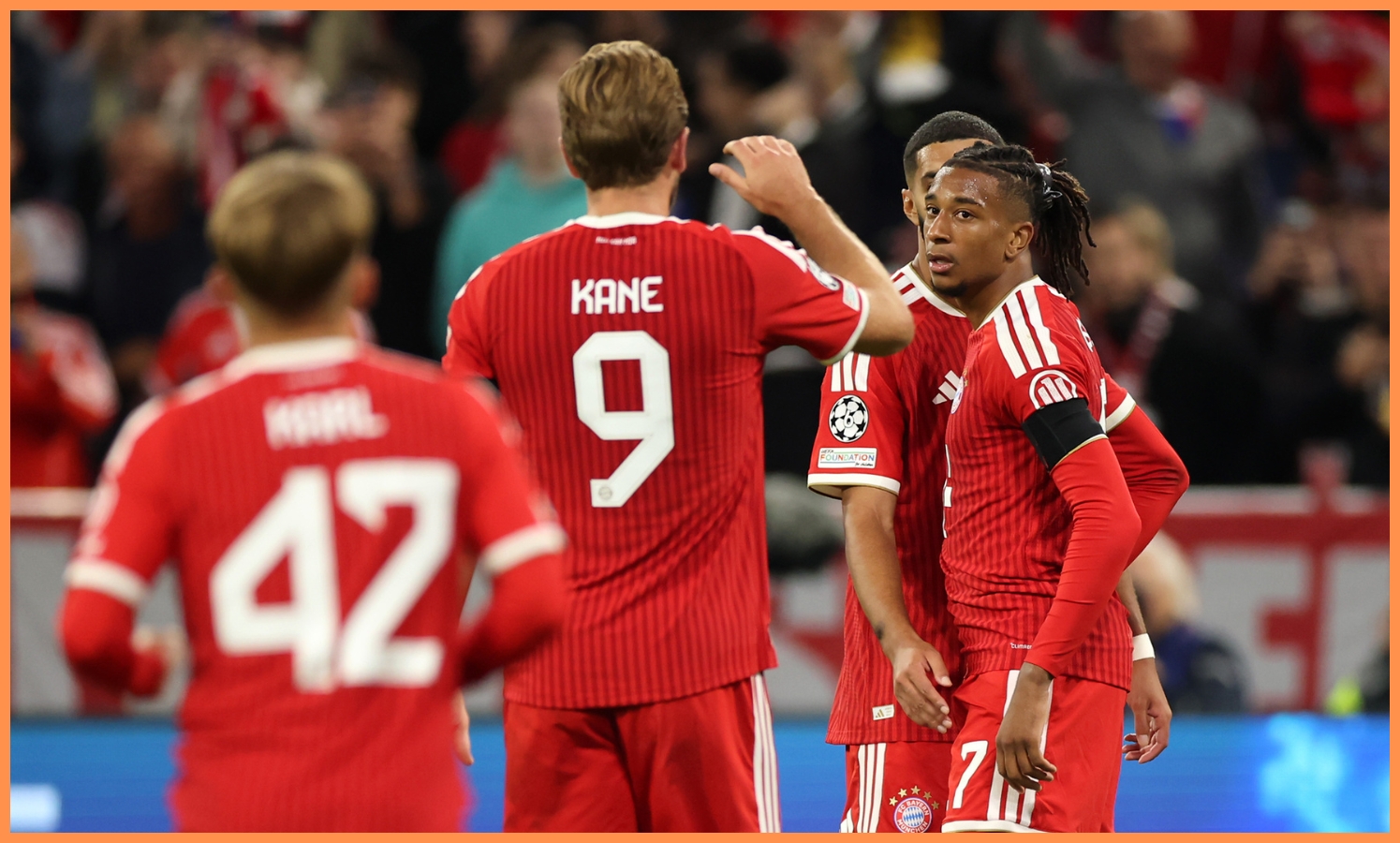 Michael Olise celebrates with his Bayern Munich teammates