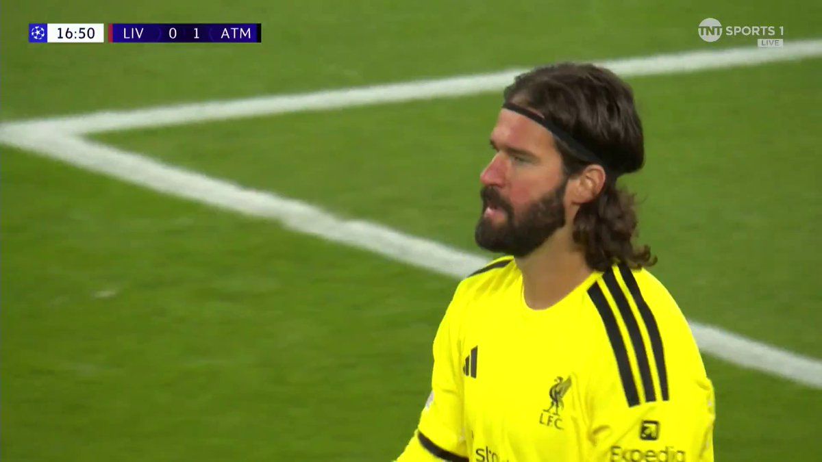 Alisson Becker looks upset after Marcos Llorente gave Atletico Madrid the lead