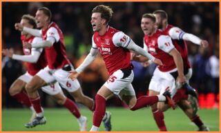 Fleetwood celebrate cup win against Arsenal. (Photo by Lewis Storey/Getty Images)