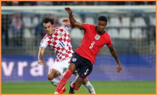 Ezri Konsa on the ball for England.