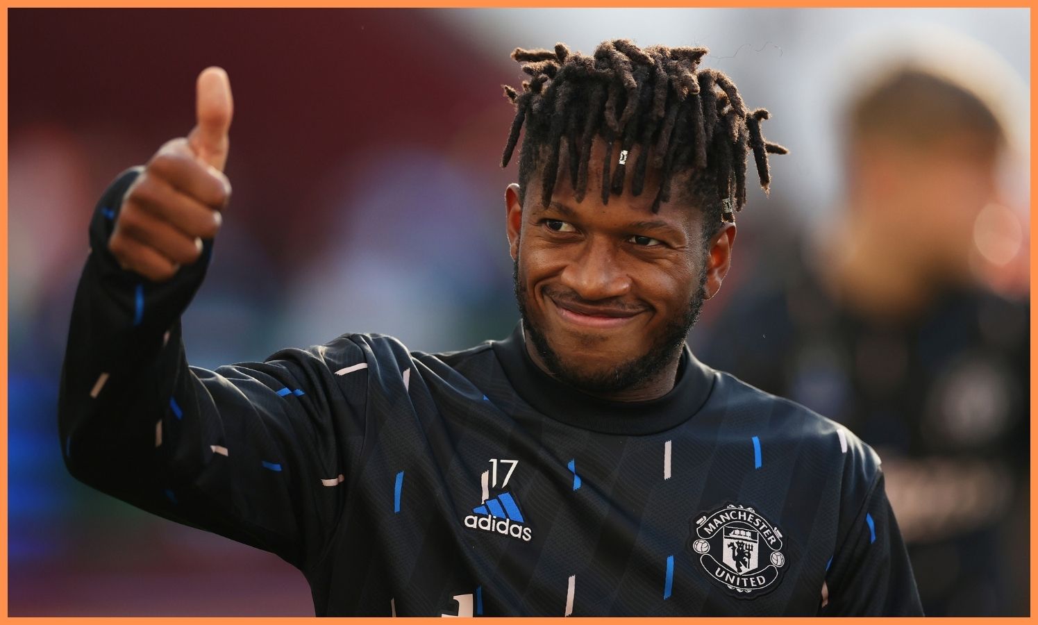 Fred salutes the fans at training.