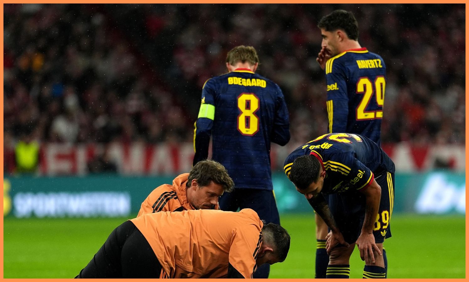 Bukayo Saka receives treatment during Bayern Munich vs Arsenal