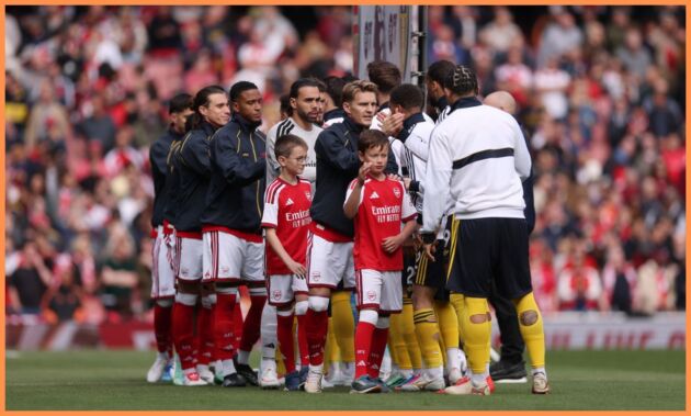 Arsenal players lining up at the Emirates Stadium