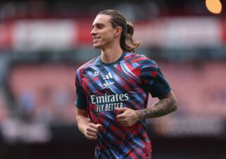 Riccardo Calafiori warming up for Arsenal