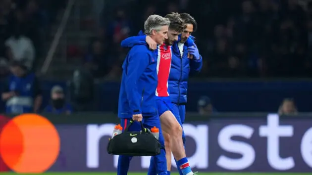 Khvicha Kvaratskhelia limps off. (Photo by Shaun Botterill/Getty Images)