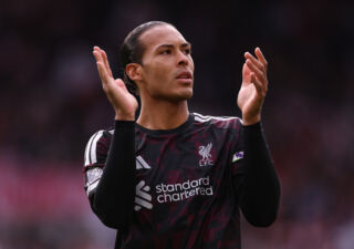 BRENTFORD, ENGLAND - OCTOBER 17: Virgil van Dijk of Liverpool applauds the fans as he warms up before the Premier League 2026/27 match between Brentford and Liverpool FC at Gtech Community Stadium on October 17, 2026 in Brentford, England.