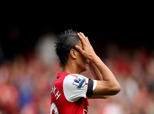 Arsenal's Marouane Chamakh reacts to a missed chance on goal