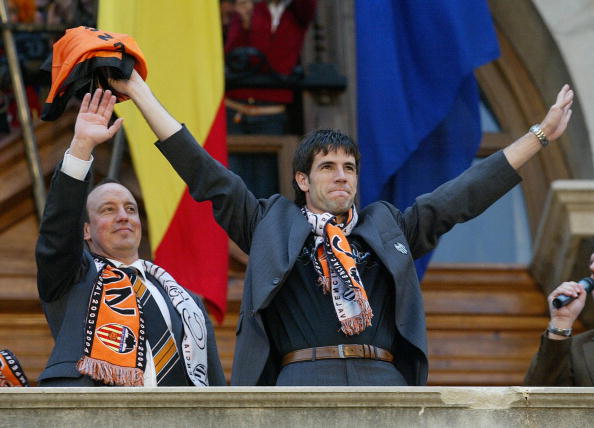 Valencia's players David Albeld (R) and