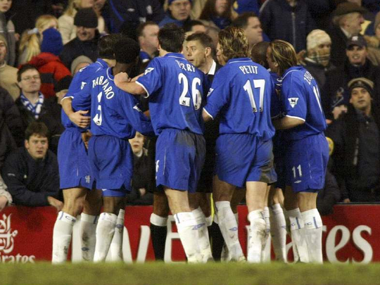 Chelsea players swarm around ref Mark Halsey
