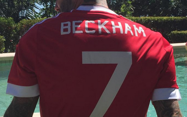 David Beckham poses in new Adidas Manchester United shirt