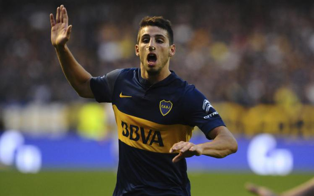 Jonathan Calleri of Boca Juniors, center, heads the ball during a