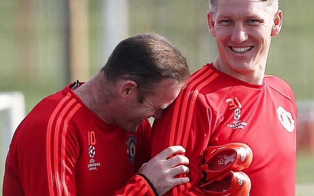 Wayne Rooney laughing with bastian schweinsteiger