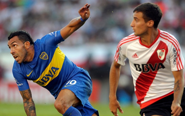 Emanuel Mammana of River Plate, Carlos Tevez of Boca Juniors
