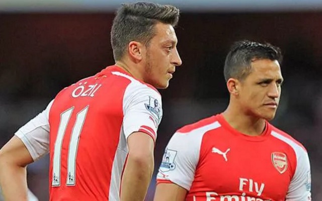 Mesut Ozil and Alexis Sanchez look sad