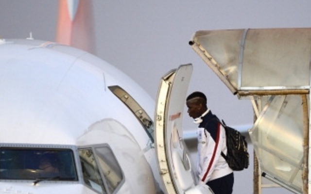 Paul Pogba boarding aeroplane