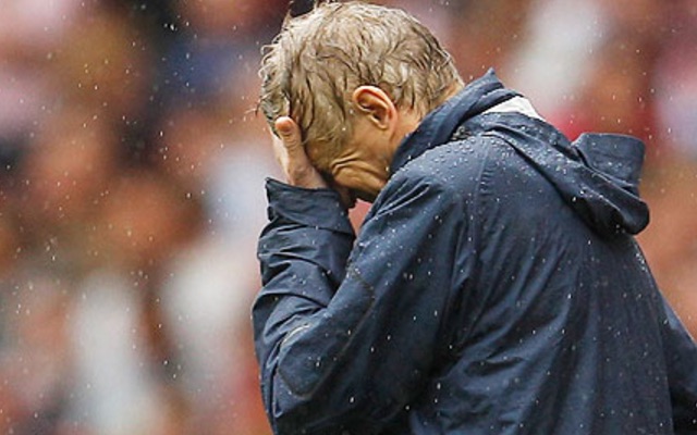Arsene Wenger in the rain
