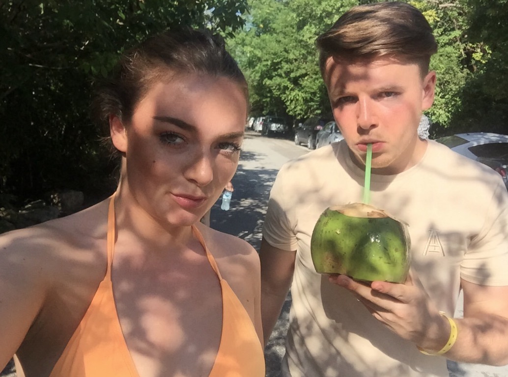 Charlie Morgan sucking a coconut