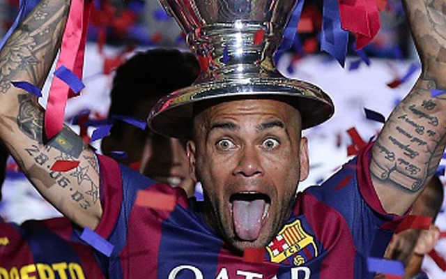 Dani Alves lifting Champions League trophy