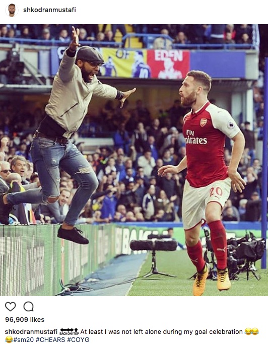 Shkodran Mustafi and Arsenal fan celebrate offside goal v Chelsea