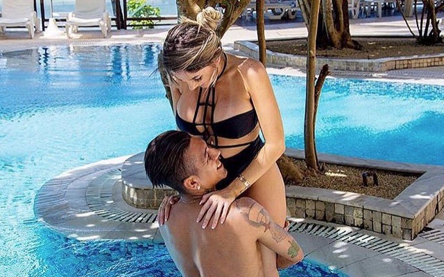 Roberto Firmino and wife Larissa Pereira enjoy a swimming pool on holiday