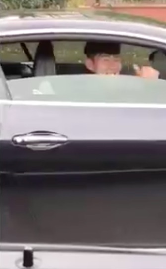 Tottenham ace Son Heung-min gives a thumbs up from his car