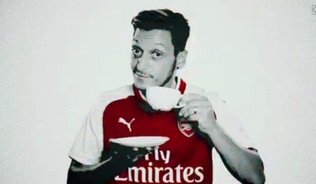 Mesut Ozil drinking a cup of tea