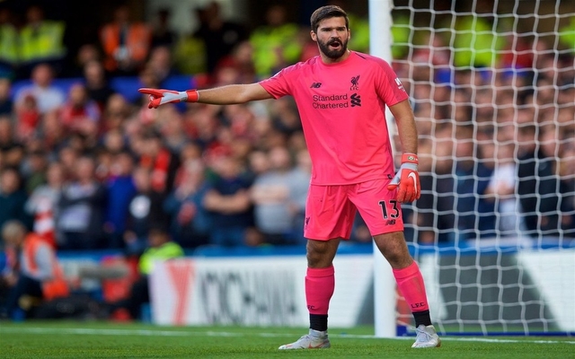 Alisson in action for Liverpool - Pink kit