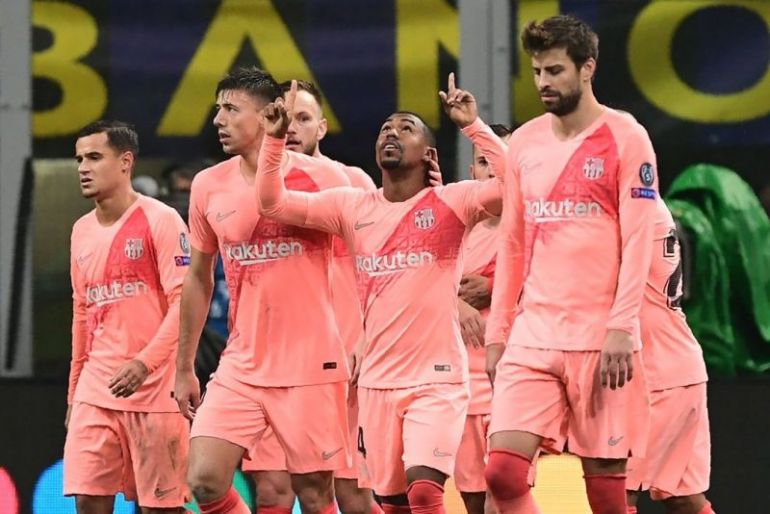 Malcom points to the sky after scoring first Barcelona goal
