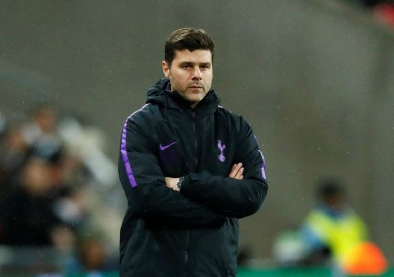 Pochettino-with-his-arms-crossed-watching-from-the-sidelines
