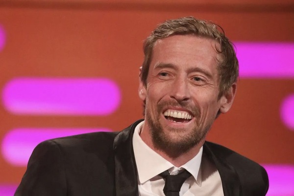 former footballer Peter Crouch smiling on a late night talk show