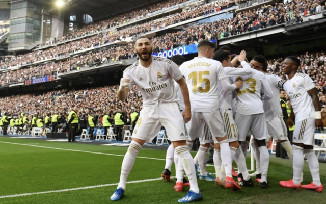 Karim Benzema celebrates in front of Real Madrid teammates following his goal in the Madrid derby