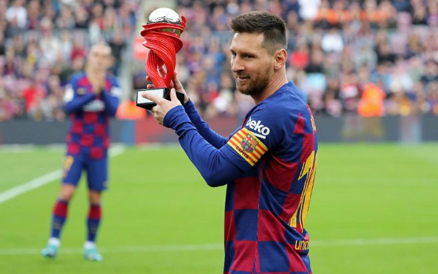 messi with award