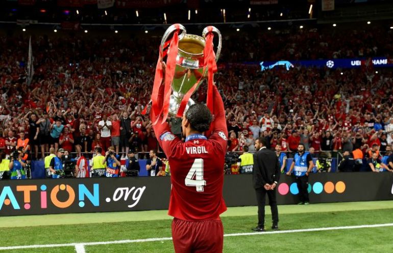 van dijk with champions league trophy