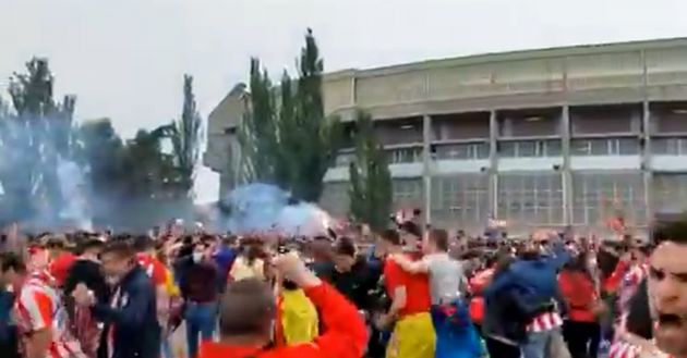 Atletico Madrid fans celebrate in Valladolid car park