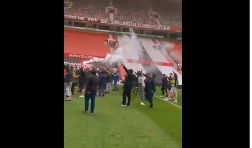 fans on pitch protest