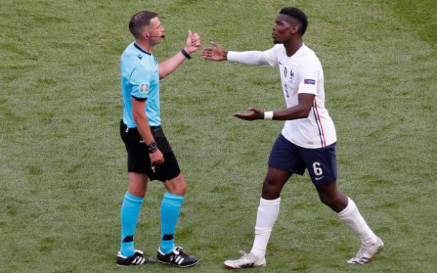 Michael Oliver talks with Paul Pogba at Euro 2020