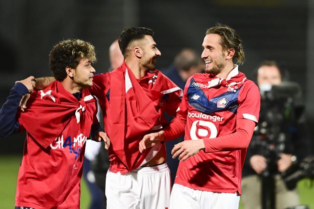 Zeki Celik (middle) celebrates Lille title win with Yazici (right)