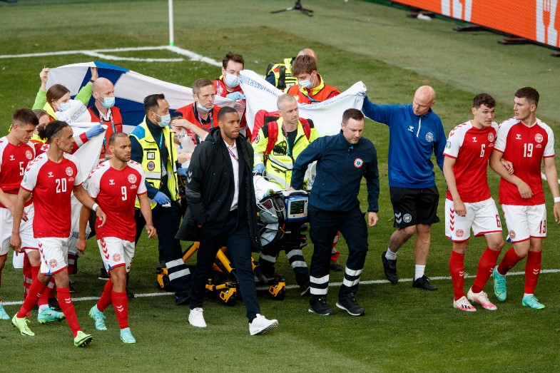 eriksen stretchered off