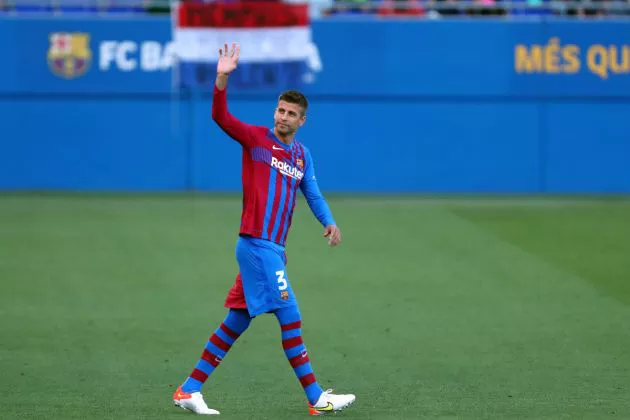 Gerard Pique waves to Barcelona fans during Juventus friendly