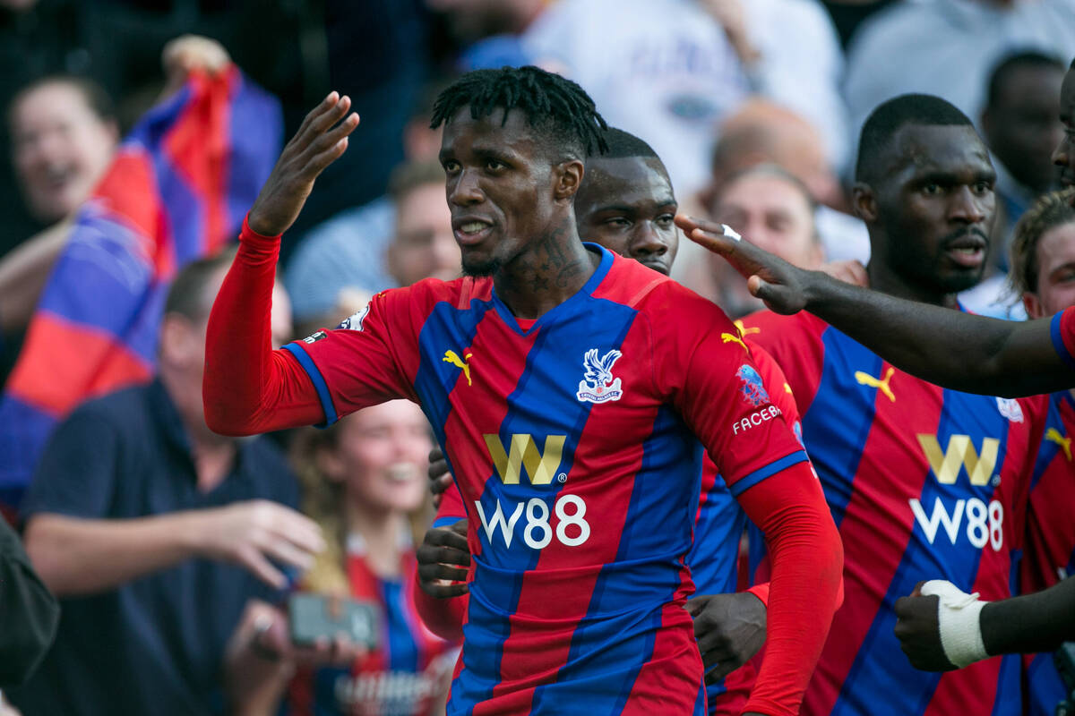 Wilfried Zaha celebrates Crystal Palace's opening goal against Tottenham Hotspur at Selhurst Park