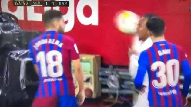 Jules Kounde throws ball at Jordi Alba